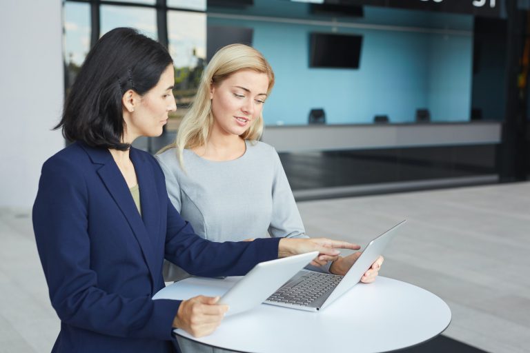 Portrait of Two Successful Businesswomen in Meeting